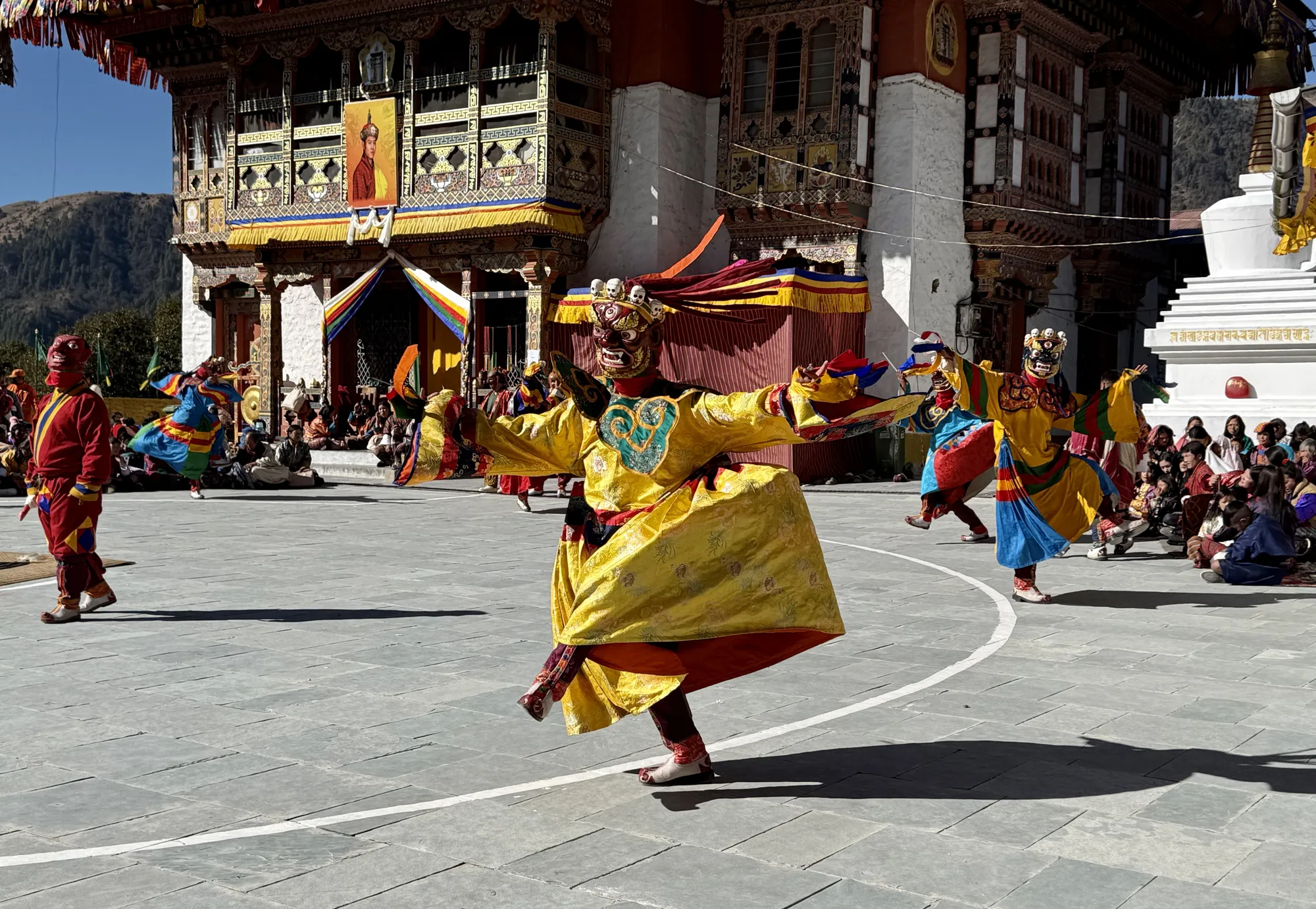Cham dancers in a dzong courtyard