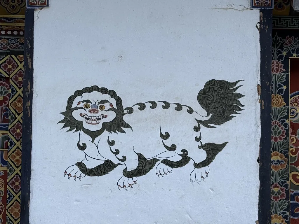 A snow lion painted on a temple wall